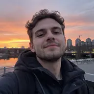 Leon taking a selfie by the riverside