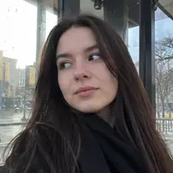 Marta taking a selfie by a window