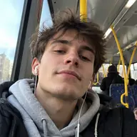 Max taking a selfie on a bus