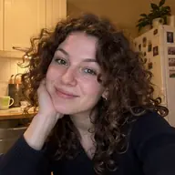Mila taking a selfie in her kitchen